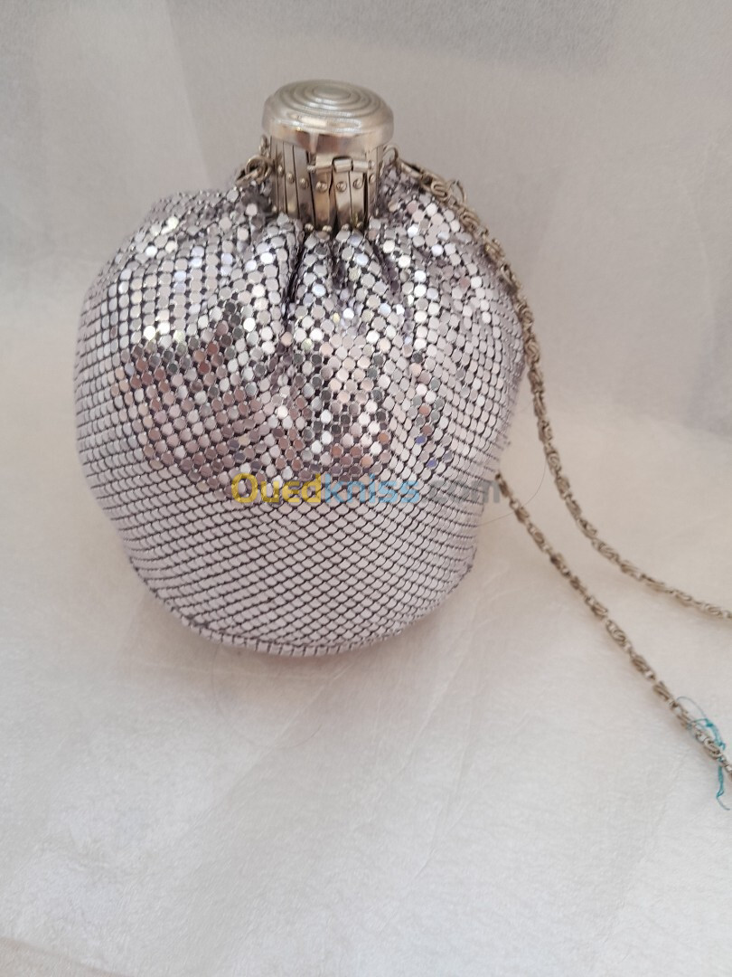 Pochette soirè argent  بوشات سواغي اغجو 