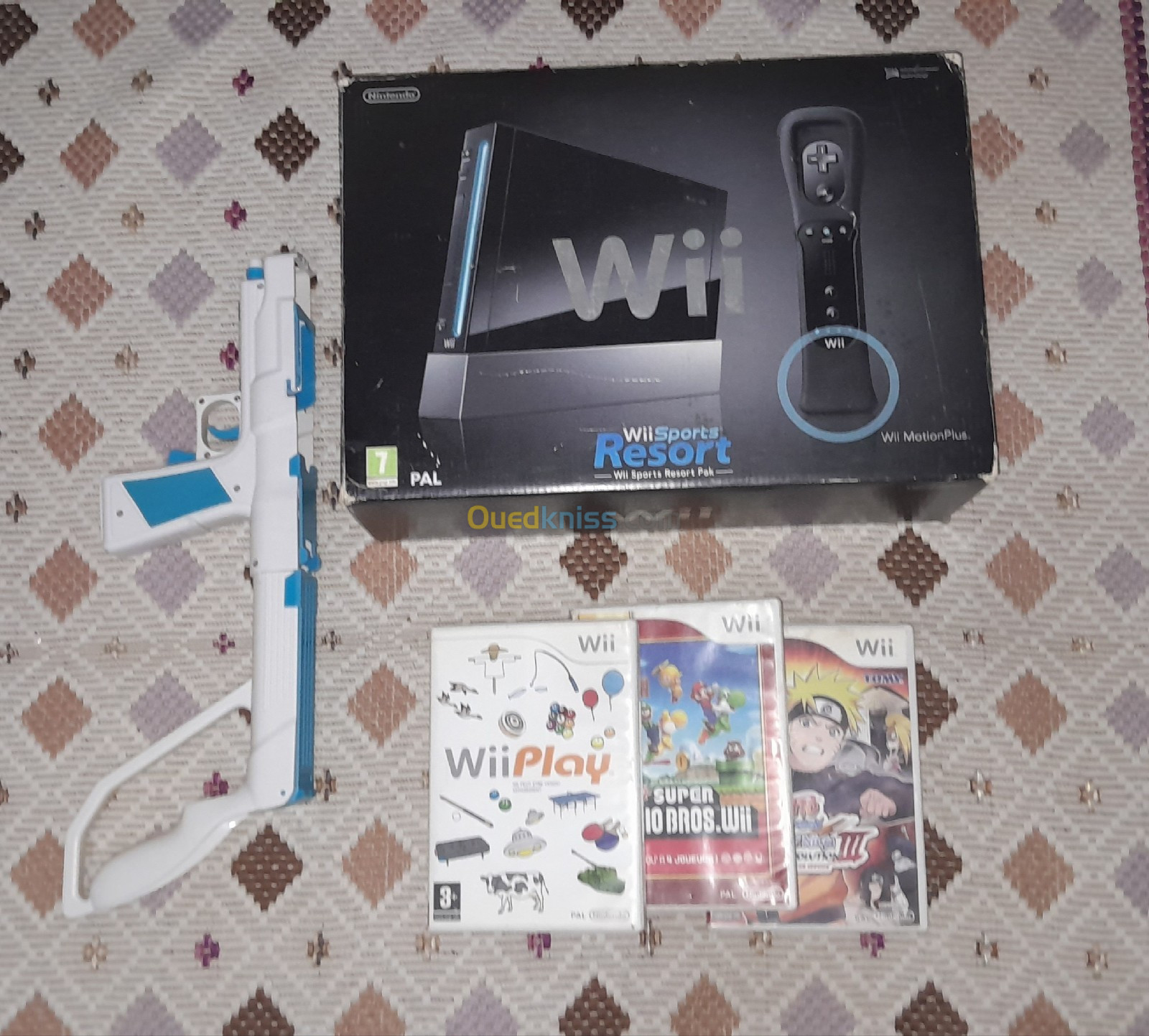 Wii avec 2 télécommande et 4 CD + un accessoire