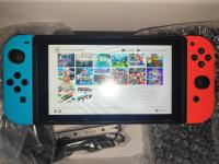 أجهزة-ألعاب-الفيديو-nintendo-switch-v1-2018-flashee-puce-128-go-excellent-etat-باب-الزوار-الجزائر