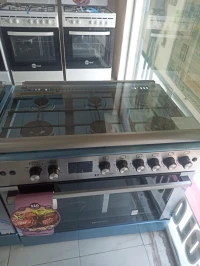 Cuisinière Arthur Martin inox gaz électrique 6 feux inox double wok système Tabouna