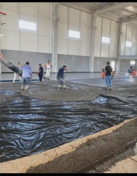 Réalisation d' une coulage de la Béton Dallage industriel Tallouchage mécanique pour Hélicoptère