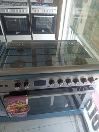 Cuisinière Arthur Martin inox gaz électrique 6 feux inox double wok système Tabouna