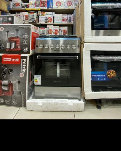 Promo cuisinière Arthur Martin Gaz Gaz4 feux fonte inox ventilé catalyseur 