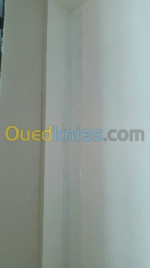 Couvre joint et joint de dilatation
