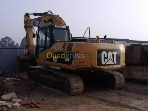 location une pelle caterpillar 323DL 