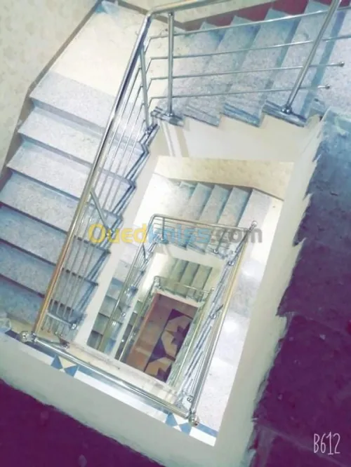 Rampes d'escaliers en inox et verre