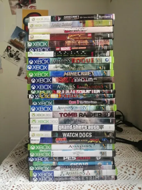 XBOX 360 + manette + 28 jeux (CD)