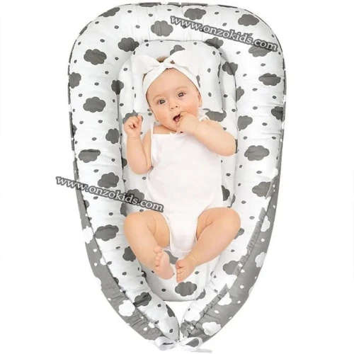 Nid bébé double face avec oreiller et drap