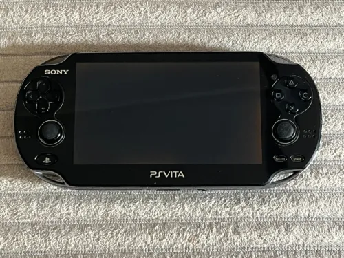 SONY PS VITA OLED Etat 10/10 64 Go + Flash et jeux