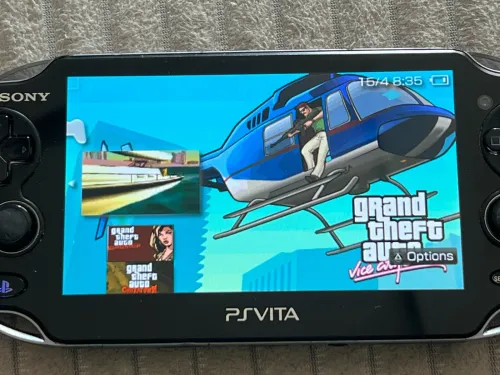 SONY PS VITA OLED Etat 10/10 64 Go + Flash et jeux