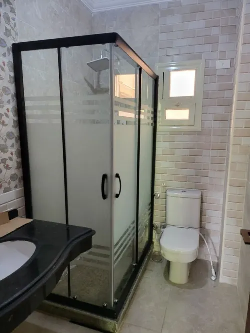 Rampe d'escalier inox et cabine douche