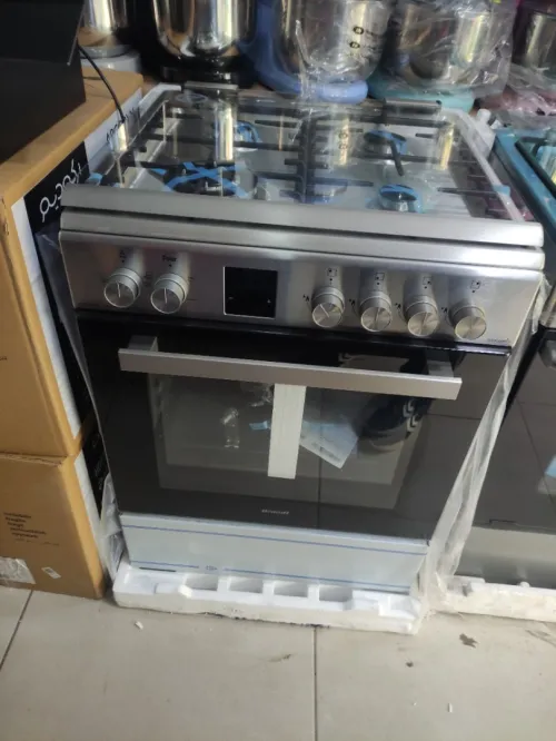 promo cuisinière Brandt inox-fonte 4 feux ventilé gaz-électrique  