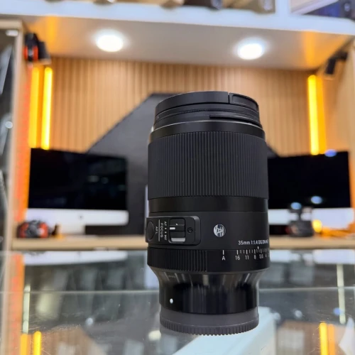 Sigma 35mm 1.4 DG DN Sony E-mount en excellent etat avec deux bouchons