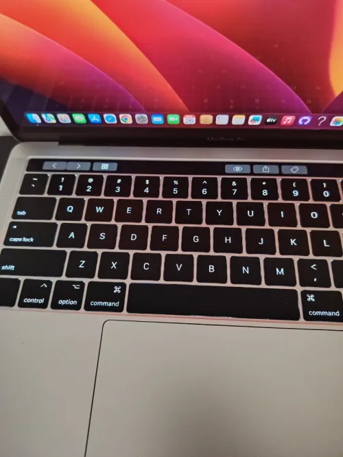 Macbook pro touchbar 2018 ramené des usa cycle de charge 40