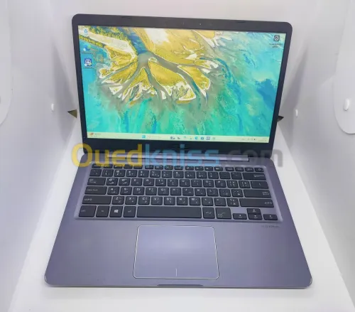 ASUS Vivobook 14 E406M / Intel N5000 / Ram 4 Gb / Disque SSD 128 Gb / 1.3 Kg / Epaisseur 17,6 mm