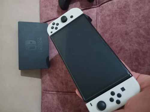 Nintendo switch oled 10/10 flache + 35 jeux + accessoires