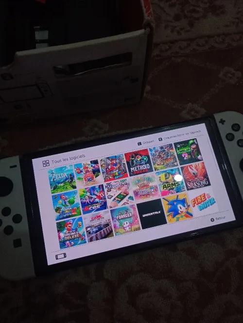 Nintendo switch Oled cartona flache + 35 jeux