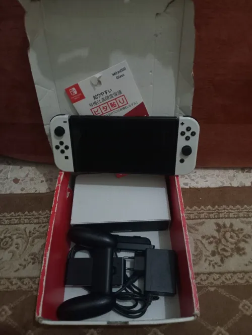 Nintendo switch Oled cartona flache + 35 jeux