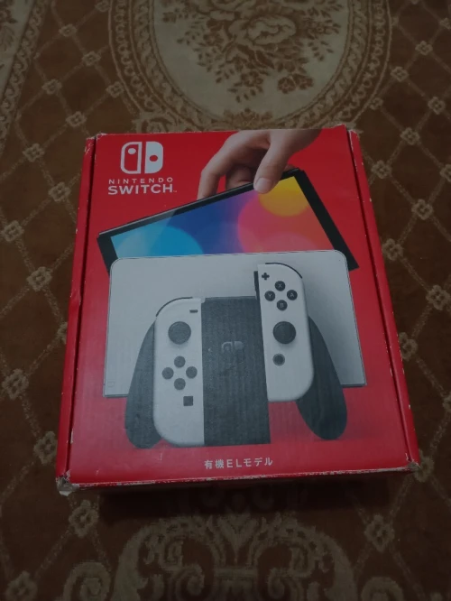 Nintendo switch oled cartona n9iya flache + 35 jeux