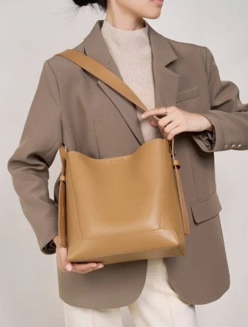 Sac seau en cuir véritable pour femme, printemps été 2026, grande capacité, bandoulière polyvalente pour le travail