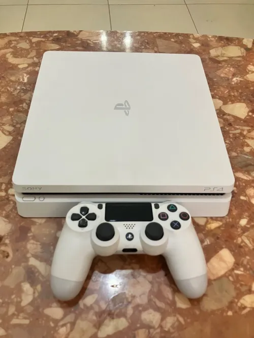 PS4 slim 500 g ,Version blanche Glacier White État : 10/10 , Flasher : 7 jeux + Manette DualShock V2