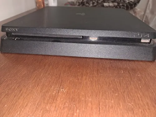 Ps4 slim 500 gb bonne occasion avec 8 jeu sans manette